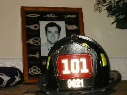 His helmet with Ladder 101 and his badge number